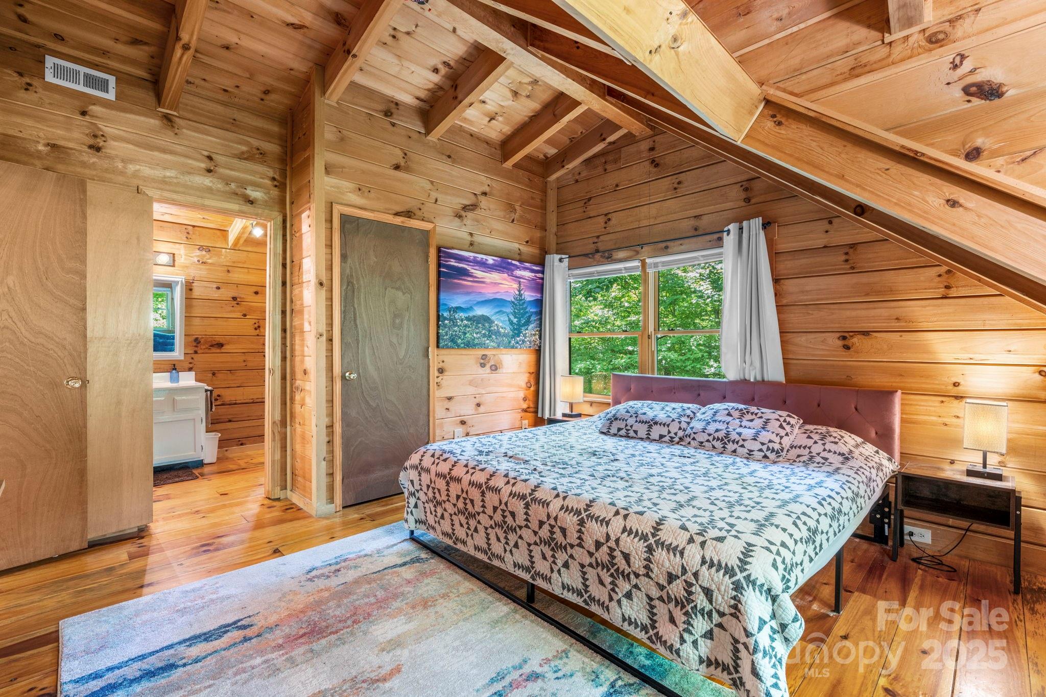 211 Granite Ridge Nebo, NC 28761 - Photo 11 of 43 a bed sitting in a bedroom next to a window