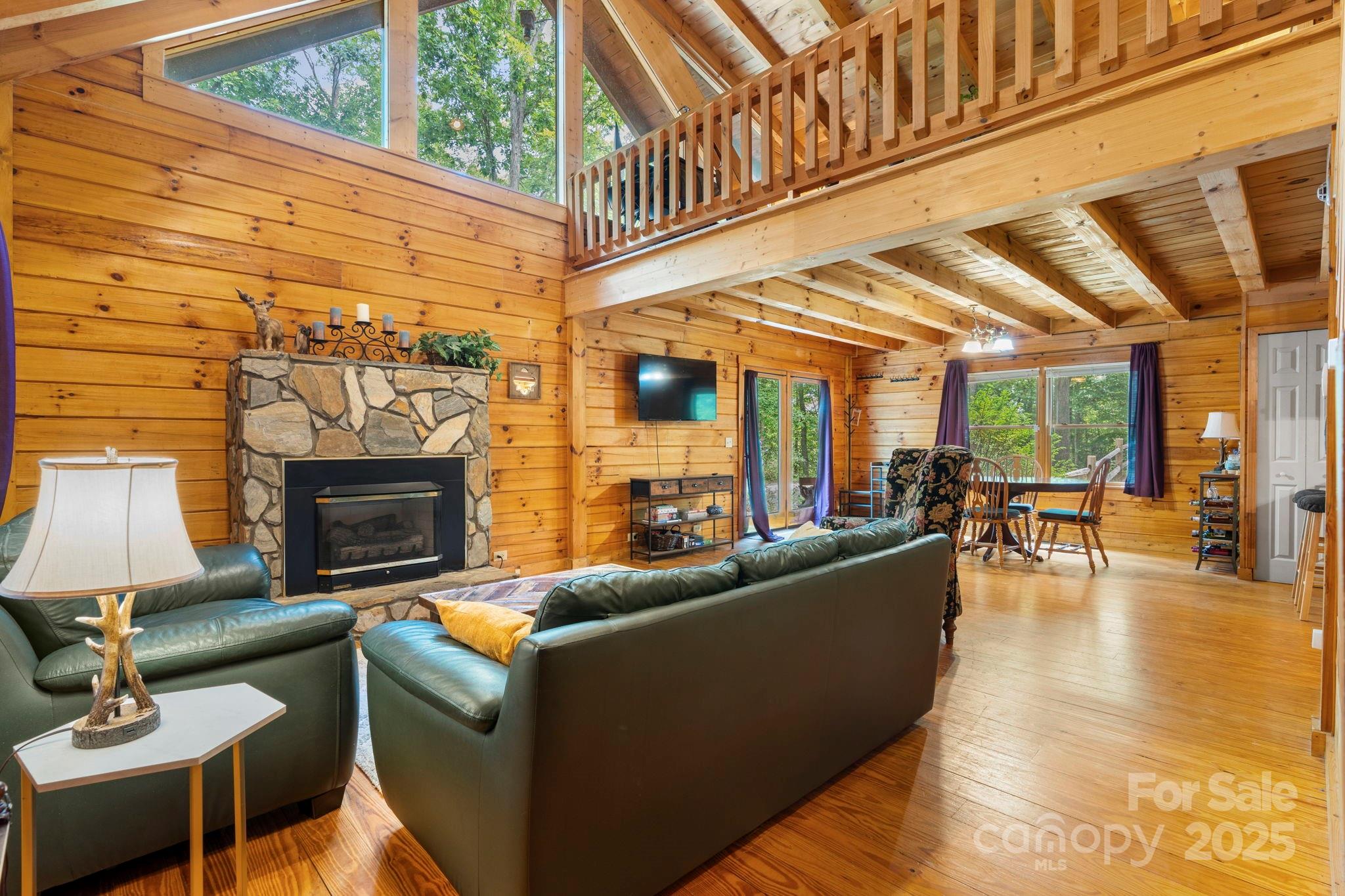 211 Granite Ridge Nebo, NC 28761 - Photo 22 of 43 a living room with furniture and a fireplace