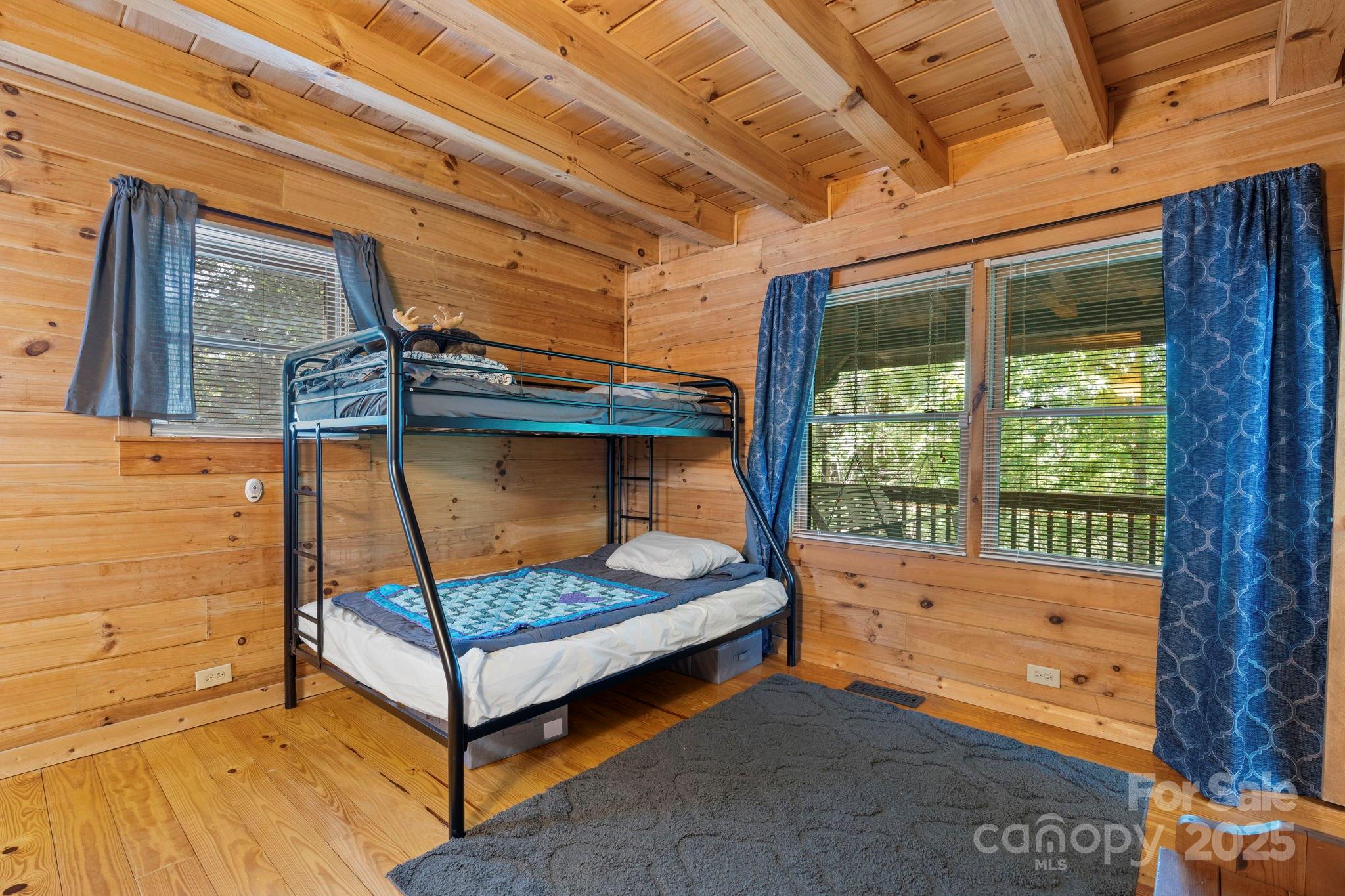 211 Granite Ridge Nebo, NC 28761 - Photo 26 of 43 a bedroom with a bed and a window