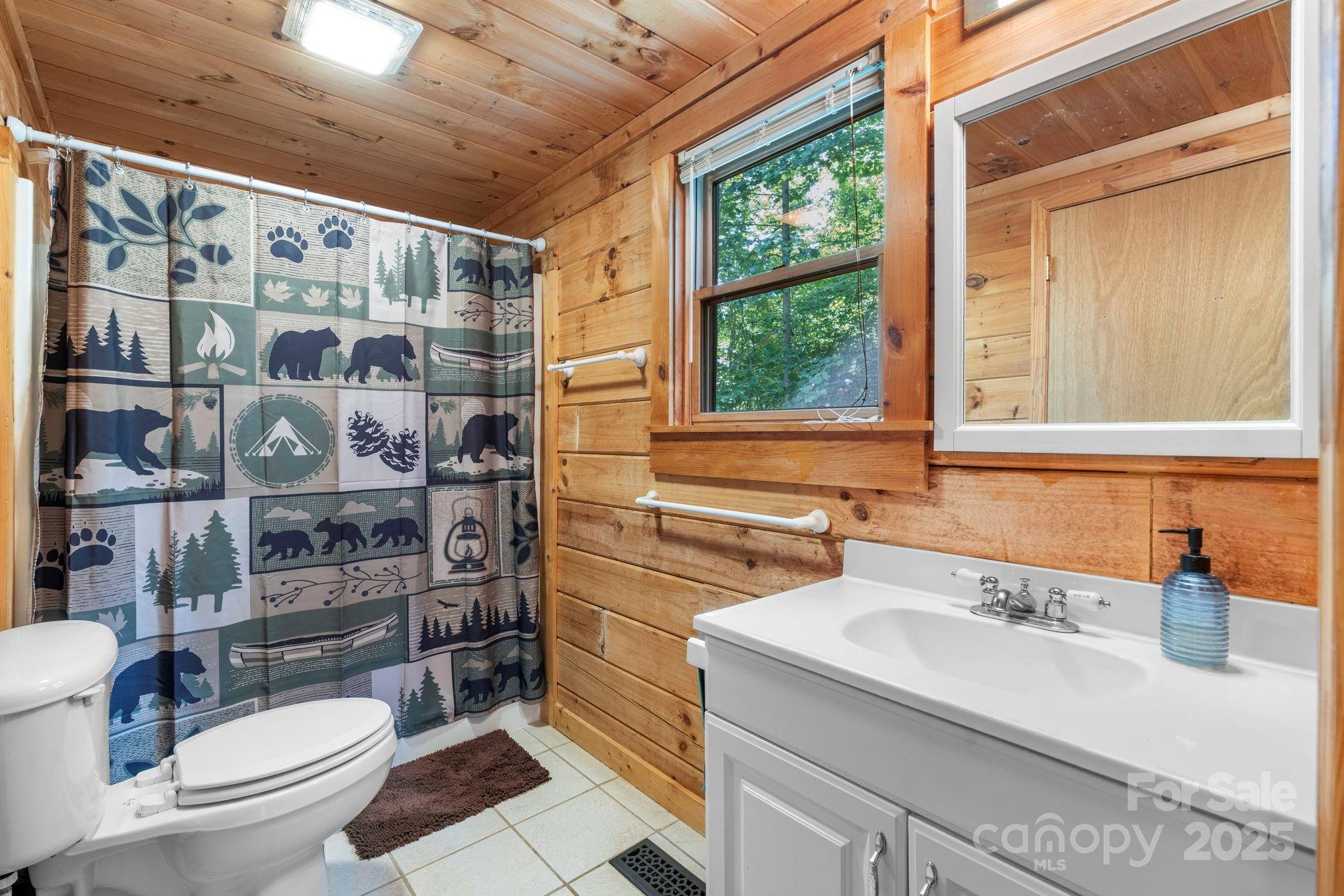 211 Granite Ridge Nebo, NC 28761 - Photo 27 of 43 a bathroom with a sink toilet and shower