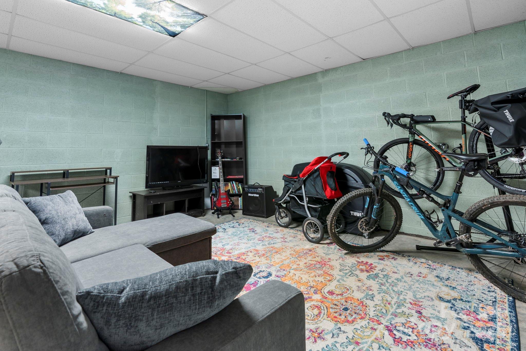 211 Granite Ridge Nebo, NC 28761 - Photo 30 of 43 a living room with furniture a flat screen tv and a flat screen tv