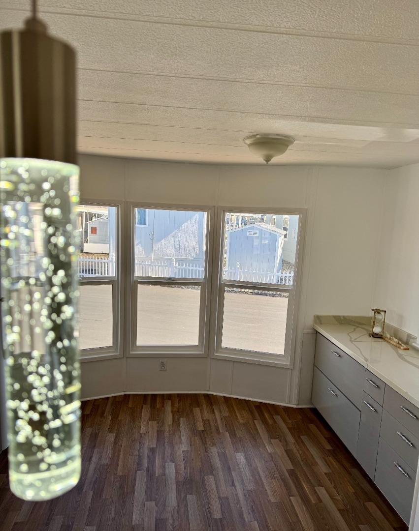 12350 Christensen Road, Unit 76 Salinas, CA 93907 - Photo 6 of 19 a view of an empty room with window and wooden floor