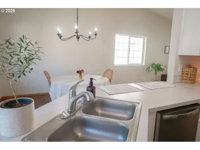 a kitchen with kitchen island a stove a refrigerator and cabinets