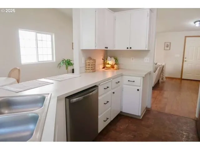 a bathroom with a sink vanity and a large mirror