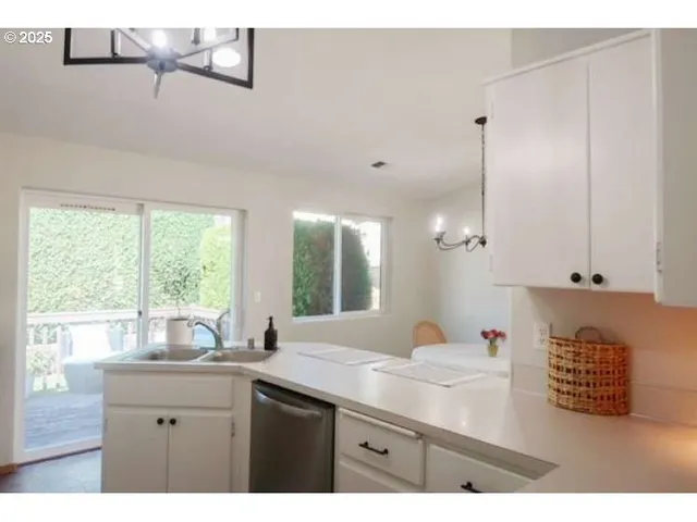 a kitchen with a refrigerator and a stove