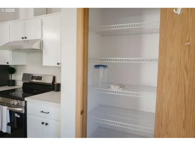 a bedroom with a bed and a table