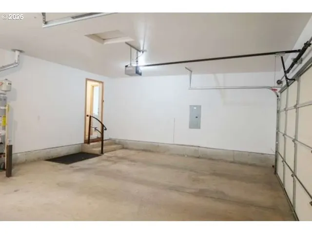 a view of a balcony with wooden floor and fence