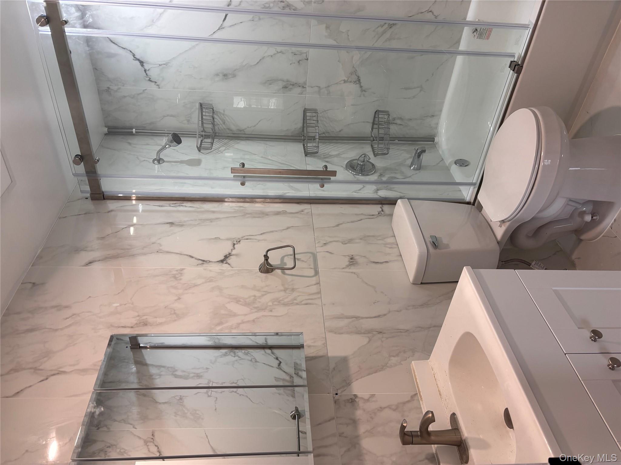 145-01 223rd Street, Unit 2 Queens, NY 11413 - Photo 5 of 12 a bathroom with a sink toilet and shower