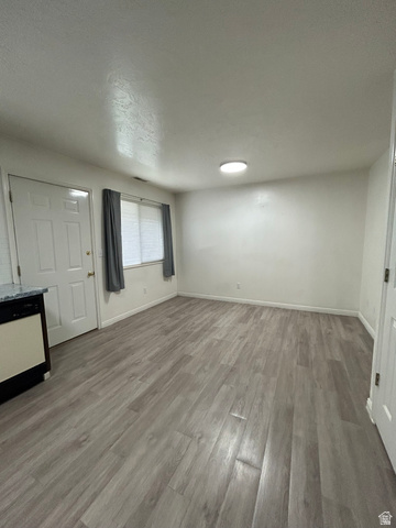 203 North Geneva Road, Unit 10 Provo, UT 84601 - Photo 4 of 16 Open-concept living space with wood-finish flooring, recessed lighting, and ample natural light from multiple windows