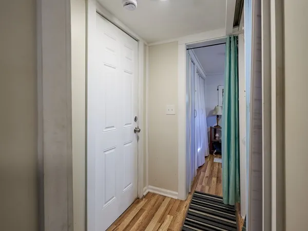 a view of a bathroom from a hallway