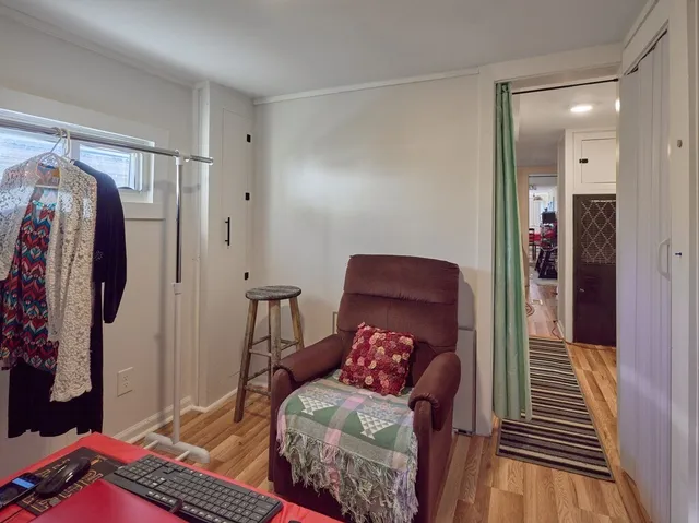 a bedroom with furniture and a window