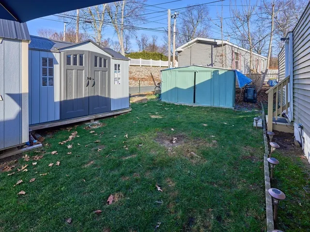 a view of house with backyard