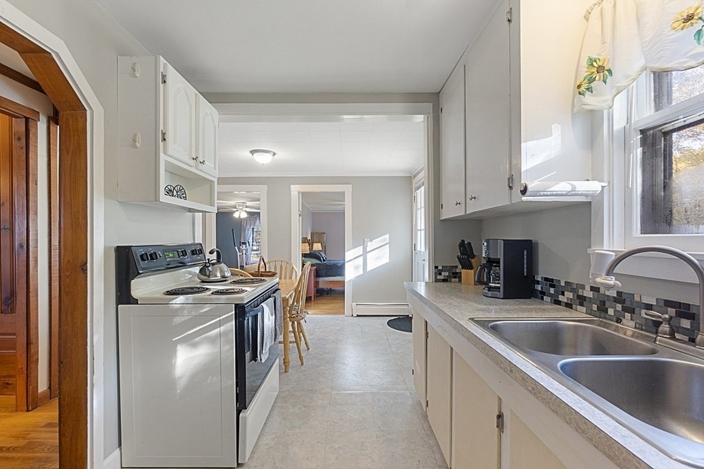 86 East Road Westminster, MA 01473 - Photo 11 of 29 a kitchen with stainless steel appliances granite countertop a sink stove and refrigerator
