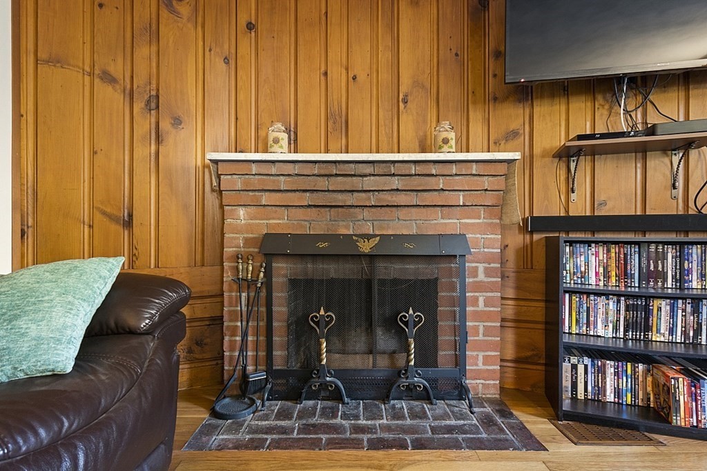 86 East Road Westminster, MA 01473 - Photo 17 of 29 a living room with furniture a bookshelf and kitchen view