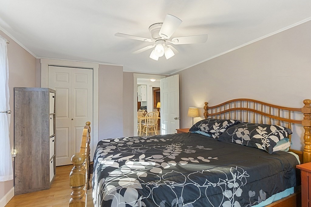 86 East Road Westminster, MA 01473 - Photo 22 of 29 a bedroom with a large bed and a chandelier