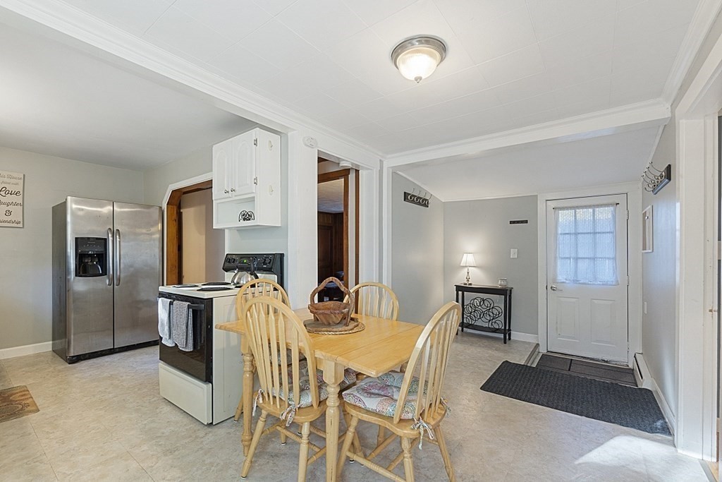 86 East Road Westminster, MA 01473 - Photo 5 of 29 a view of a dining room with furniture and a refrigerator