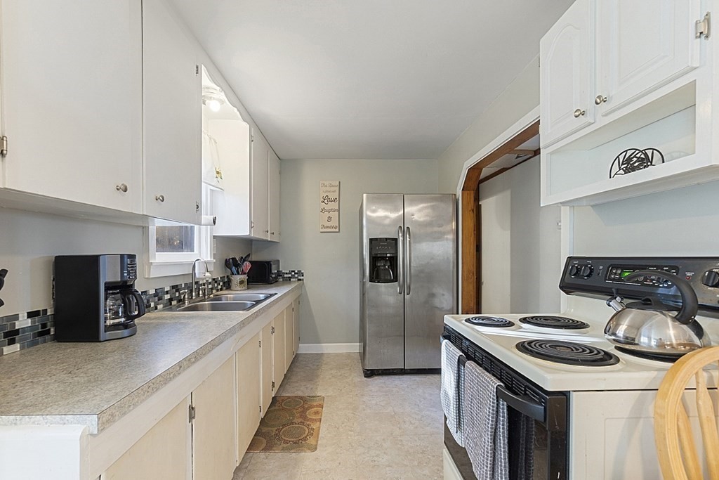 86 East Road Westminster, MA 01473 - Photo 9 of 29 a kitchen with stainless steel appliances granite countertop a stove a refrigerator and a sink