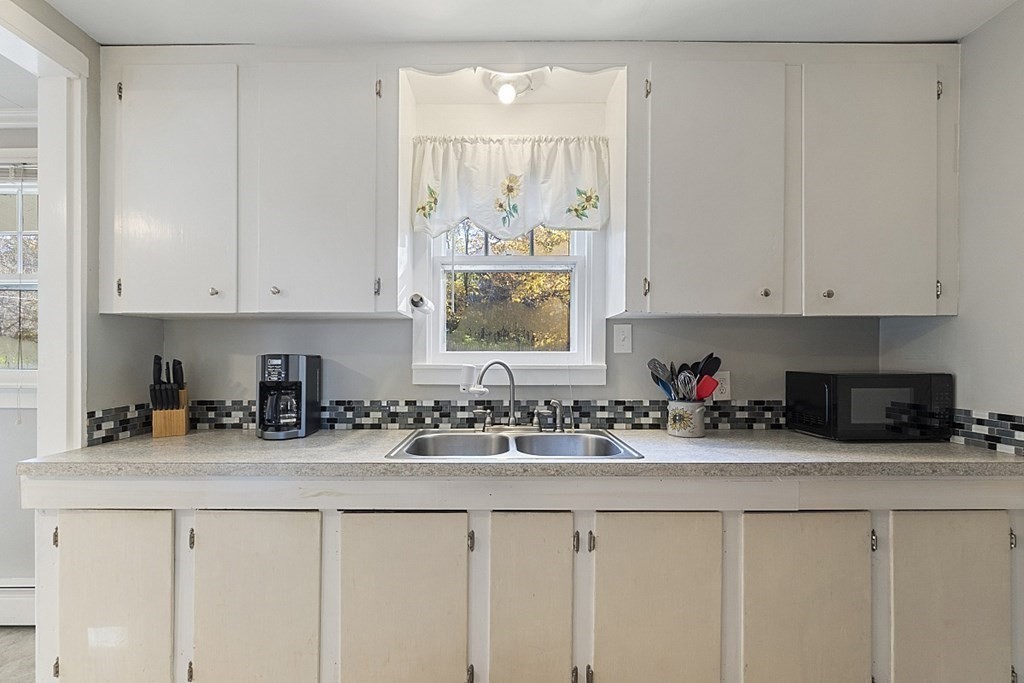 86 East Road Westminster, MA 01473 - Photo 10 of 29 a kitchen with stainless steel appliances white cabinets and a sink