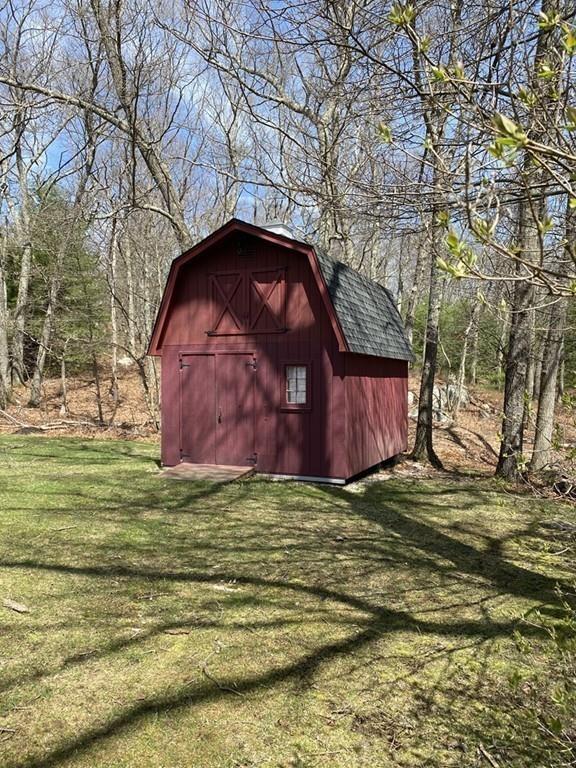 26 Charlton Road Dudley, MA 01571 - Photo 28 of 30 a backyard of a house with lots of green space