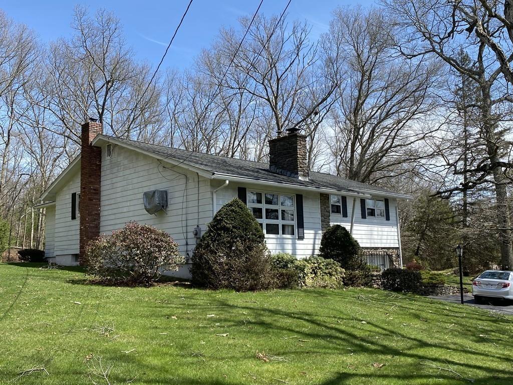 26 Charlton Road Dudley, MA 01571 - Photo 3 of 30 a front view of house with yard and green space