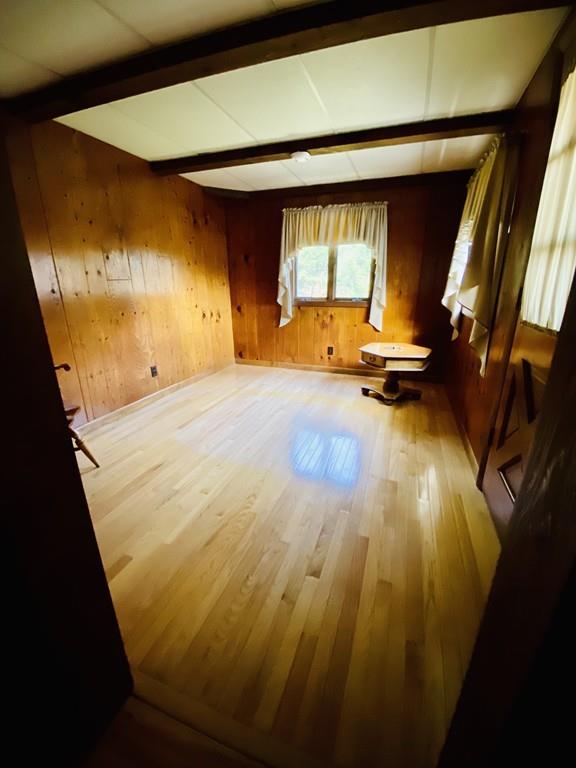 26 Charlton Road Dudley, MA 01571 - Photo 10 of 30 a view of a room with wooden floor and chair