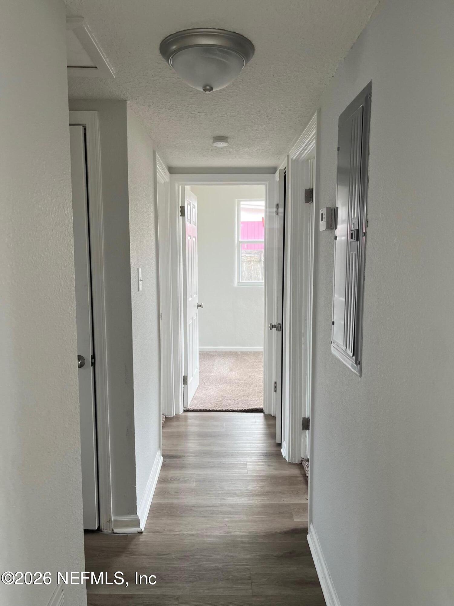 10547 Briarcliff Road East Jacksonville, FL 32218 - Photo 11 of 33 a view of a hallway with wooden floor