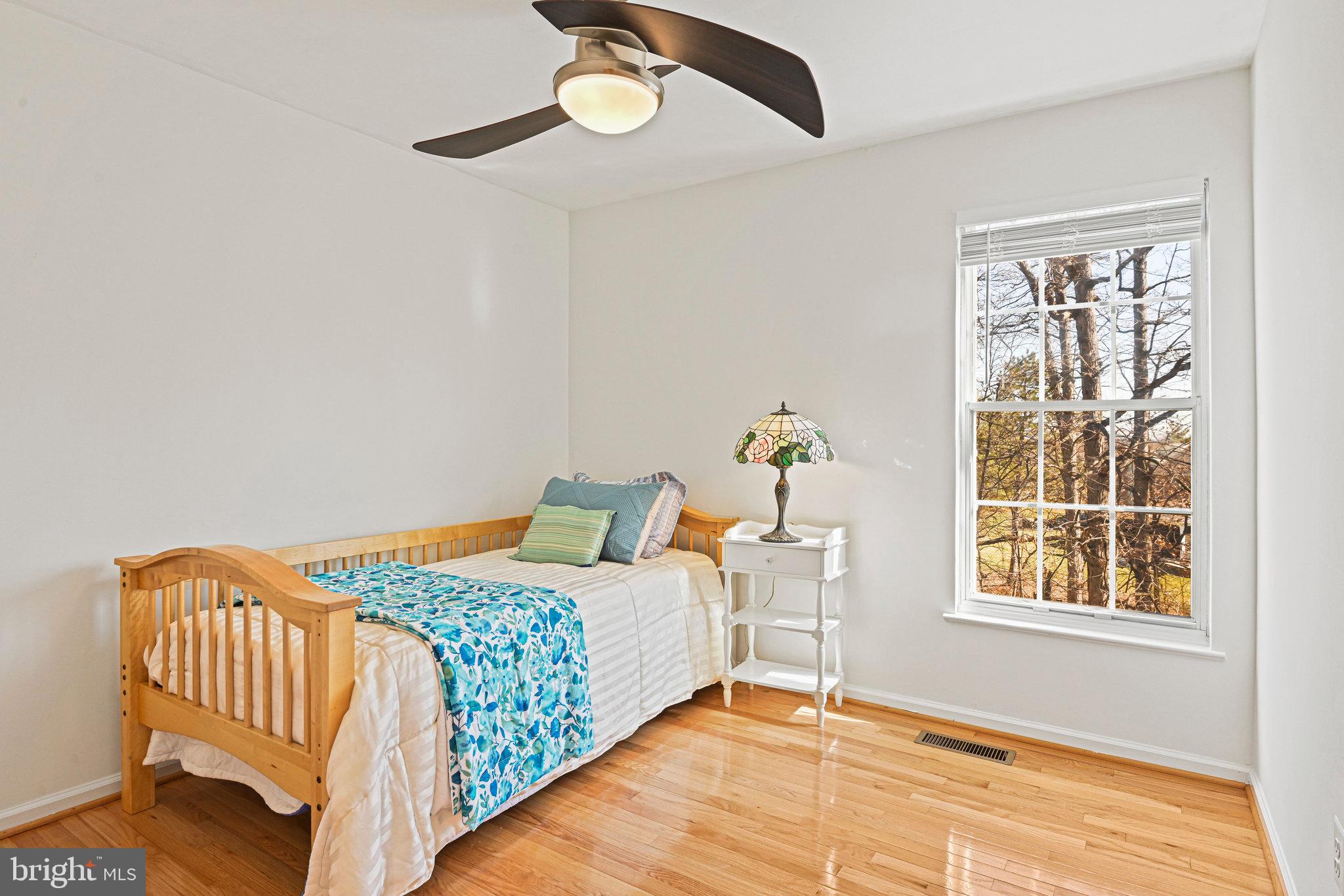 20678 Citation Drive Ashburn, VA 20147 - Photo 16 of 22 a bedroom with a bed and a window