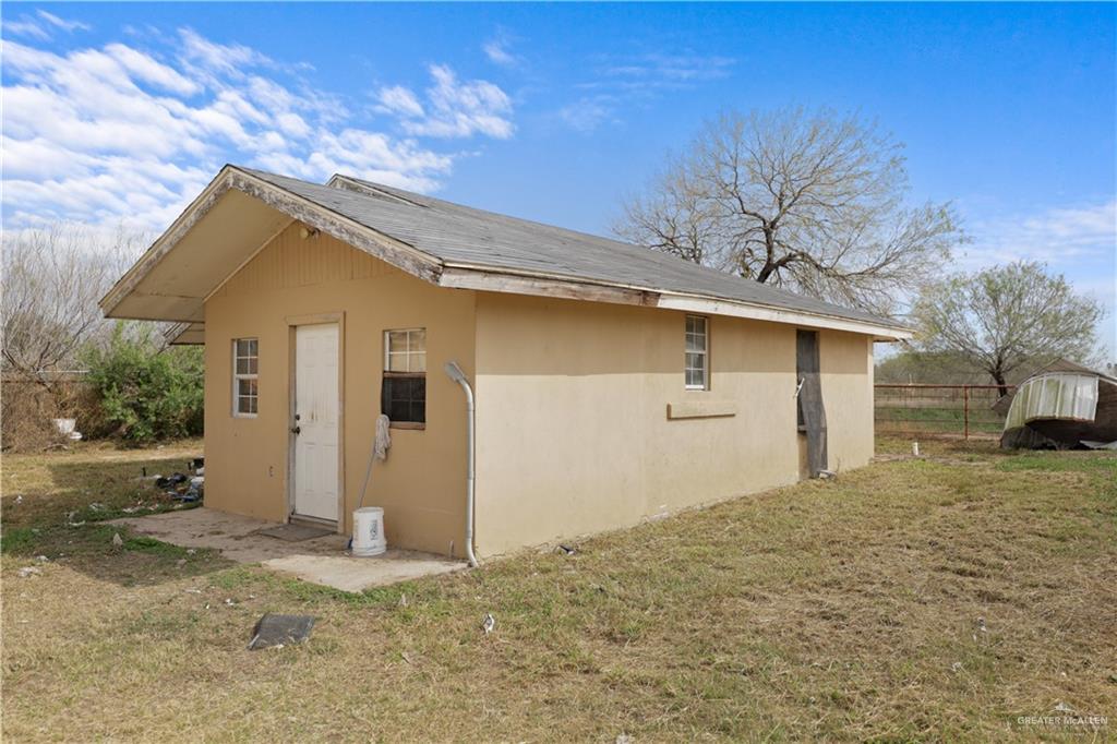 14061 Benito A Ramirez Road Edcouch, TX 78538 - Photo 9 of 16 a front view of a house with a yard