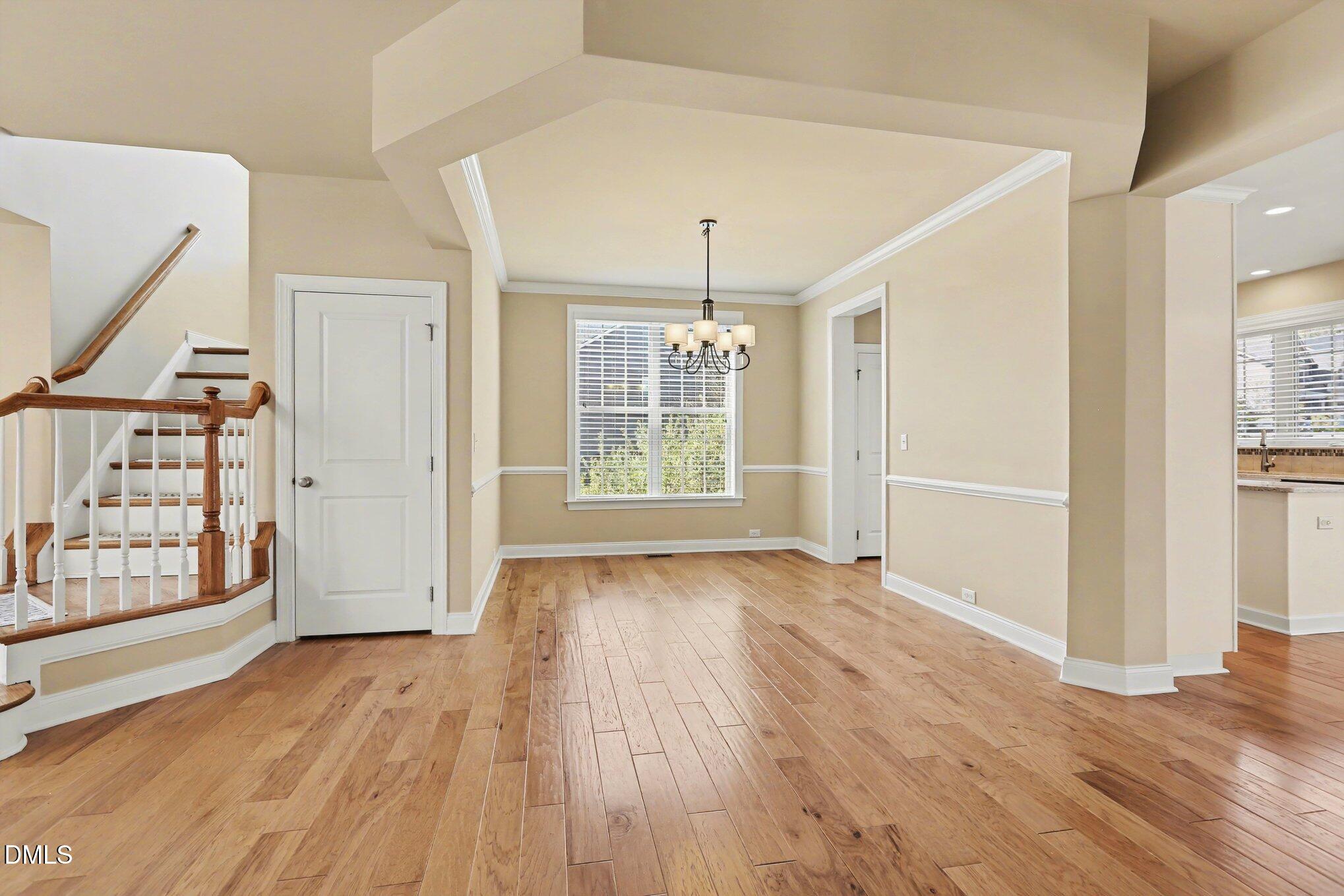 351 Gartrell Way Cary, NC 27519 - Photo 7 of 51 wooden floor in an empty room with a window