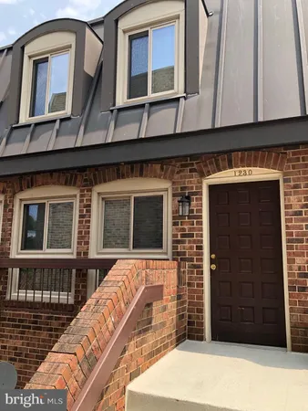 a front view of a house with a garage