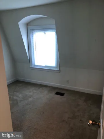 a view of a room with an empty space