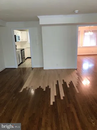 wooden floor in a hall with an entryway