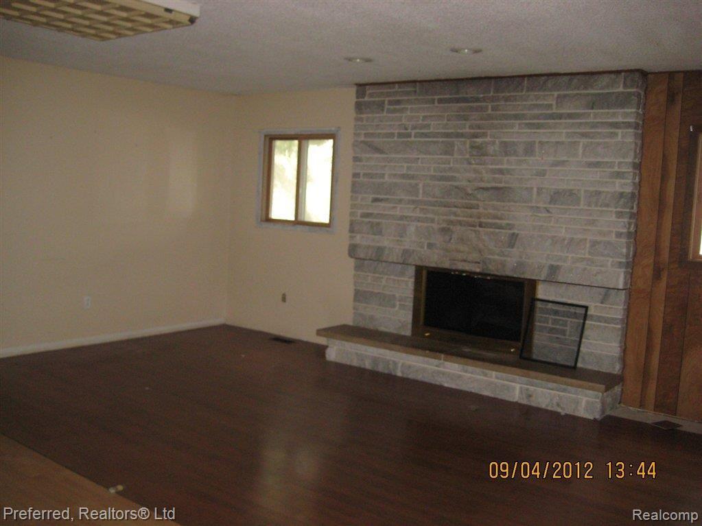 8809 Rawsonville Road Belleville, MI 48111 - Photo 14 of 24 family room fireplace