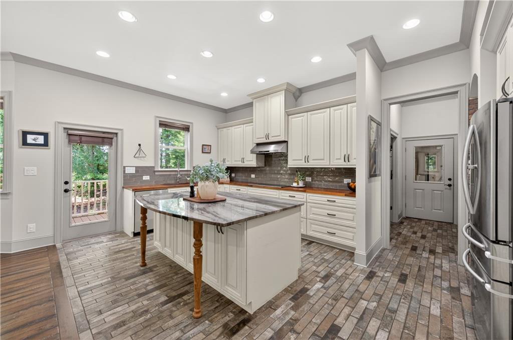 632 Geiger Road Jefferson, GA 30549 - Photo 19 of 55 a kitchen with white cabinets and sink