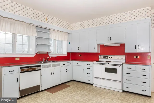 a spacious bedroom with a large bed and a window