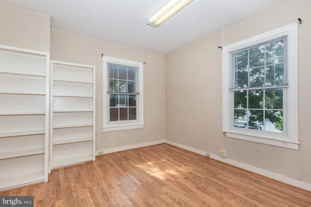 a view of a patio with couches chairs and potted plants