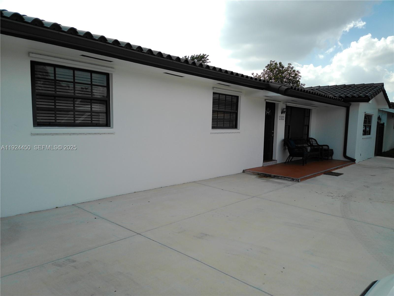 10812 Southwest 33rd Street Miami, FL 33165 - Photo 16 of 18 front view of a house