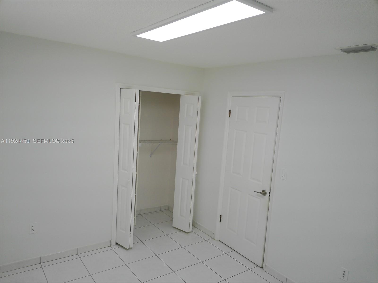 10812 Southwest 33rd Street Miami, FL 33165 - Photo 8 of 18 a view of an empty room
