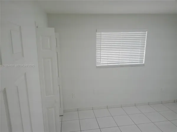 a view of an empty room with window