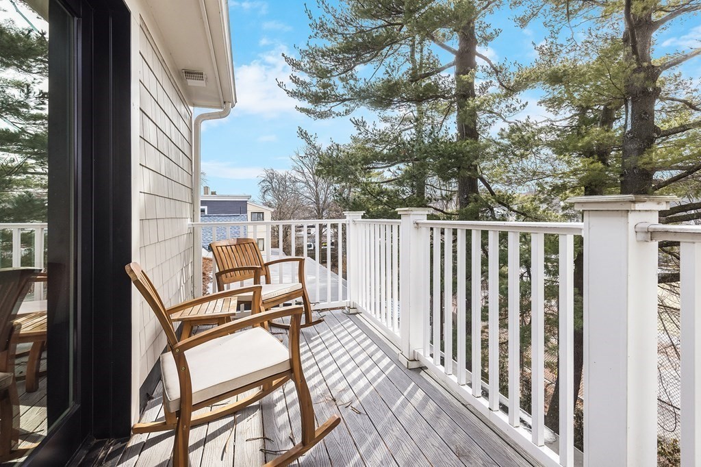 81-83 Alpine Street, Unit 2 Somerville, MA 02144 - Photo 13 of 24 a view of a two chairs on the deck
