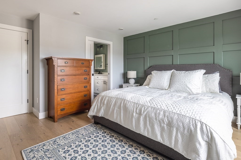 81-83 Alpine Street, Unit 2 Somerville, MA 02144 - Photo 14 of 24 a bedroom with a bed and a cabinets