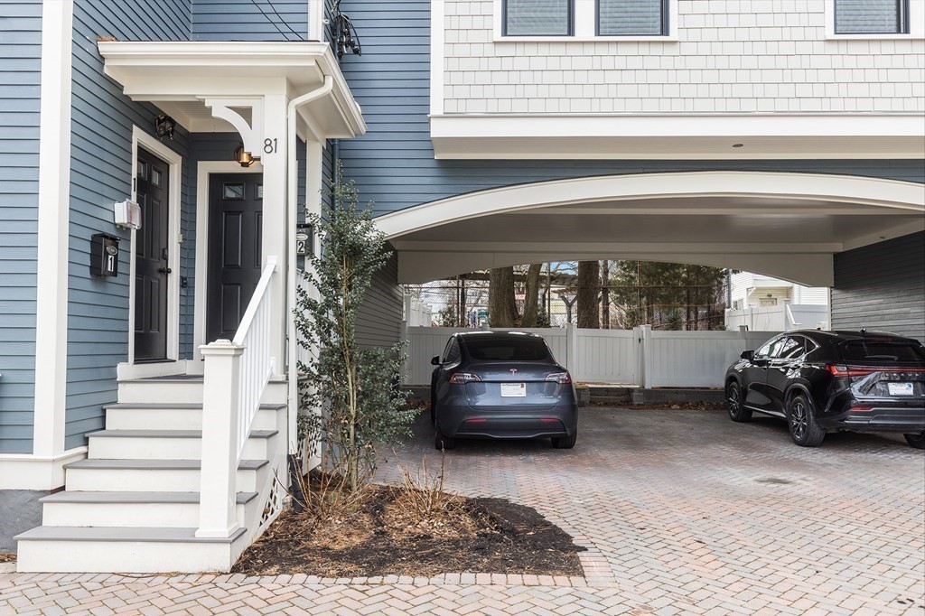 81-83 Alpine Street, Unit 2 Somerville, MA 02144 - Photo 22 of 24 a view of a car parked in front of a house