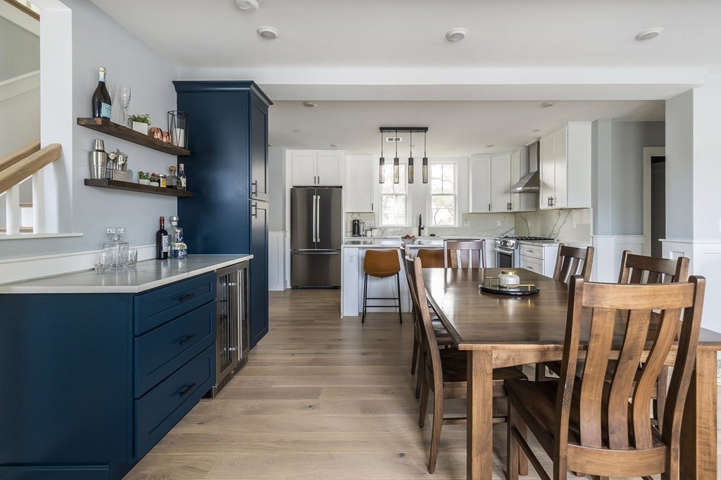 81-83 Alpine Street, Unit 2 Somerville, MA 02144 - Photo 4 of 24 a large kitchen with a table and chairs