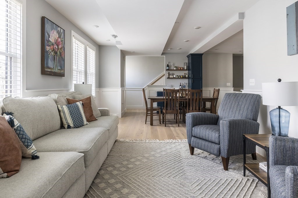 81-83 Alpine Street, Unit 2 Somerville, MA 02144 - Photo 6 of 24 a living room with furniture and wooden floor