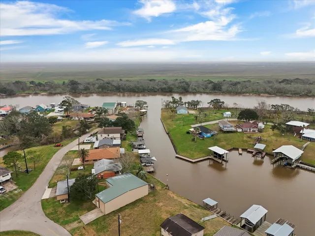 an aerial view of a residential building with outdoor space