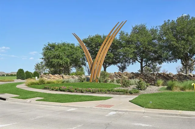 front view of a house with a yard and an trees
