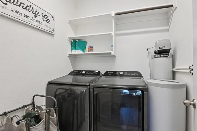 a view of storage and utility room with washer and dryer