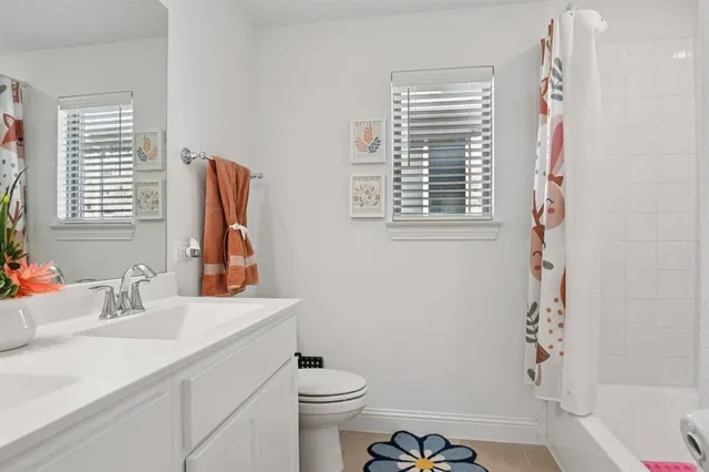 a bathroom with a sink a toilet and a bathtub