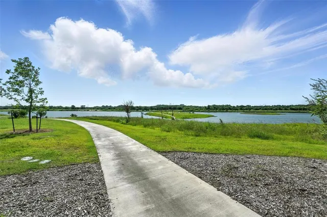 a view of a golf course with a lake