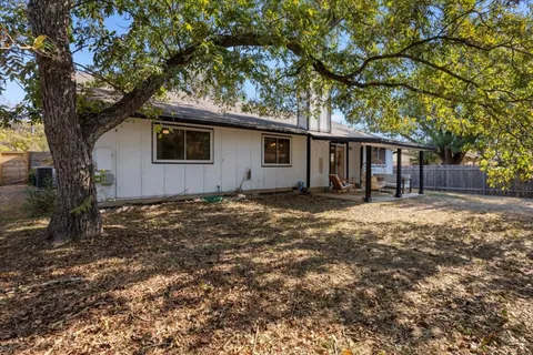 a house with trees in front of it